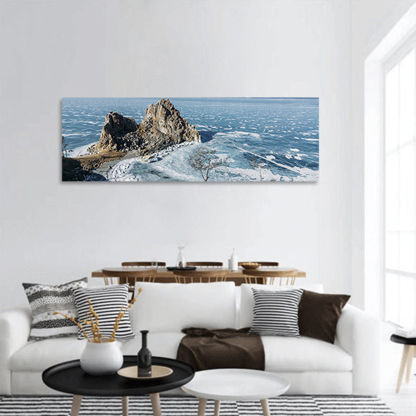 Rock formations on lake shore over water and hills Russia, Lake Baikal panoramic canvas wall art