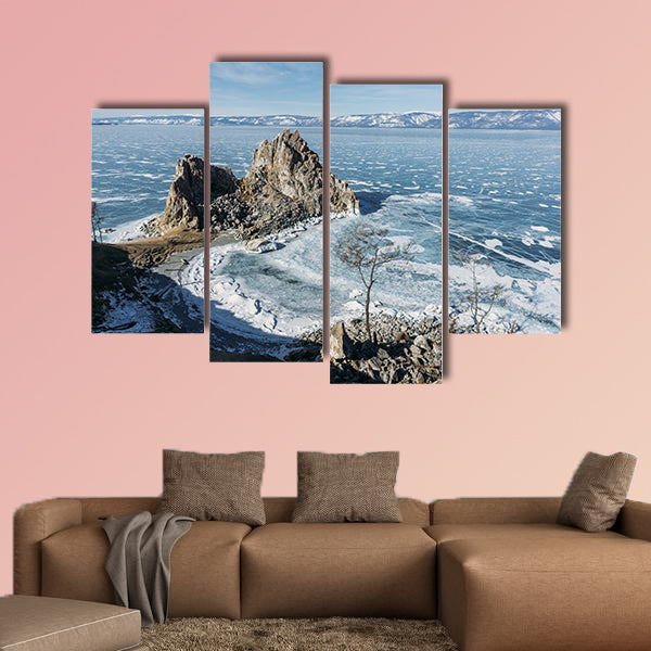 View of rock formations on lake shore over water canvas wall art