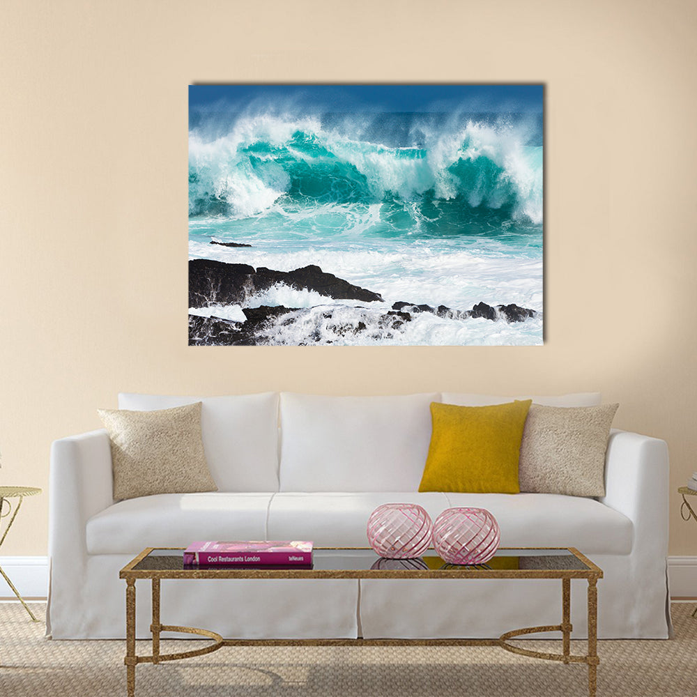 Turquoise rolling wave slaming on the rocks of the coastline Multi Panel Canvas Wall Art