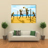 silhouettes of women playing beach volleyball Multi panel canvas wall art