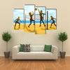 silhouettes of women playing beach volleyball Multi panel canvas wall art