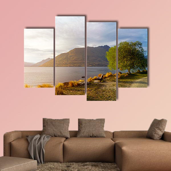 Wooden bench under tree on glowing sunset at Lake Wakatipu wall art