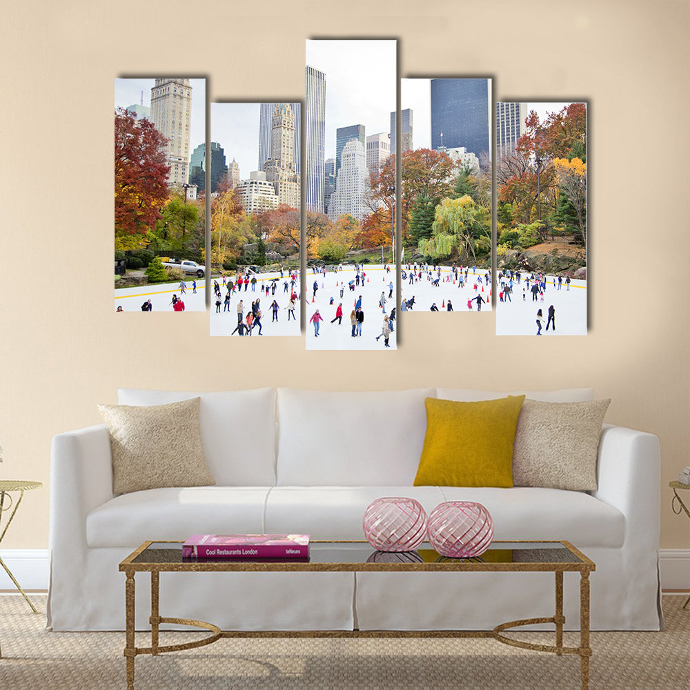 Ice skaters having fun in New York Central Park in fall Multi panel canvas wall art