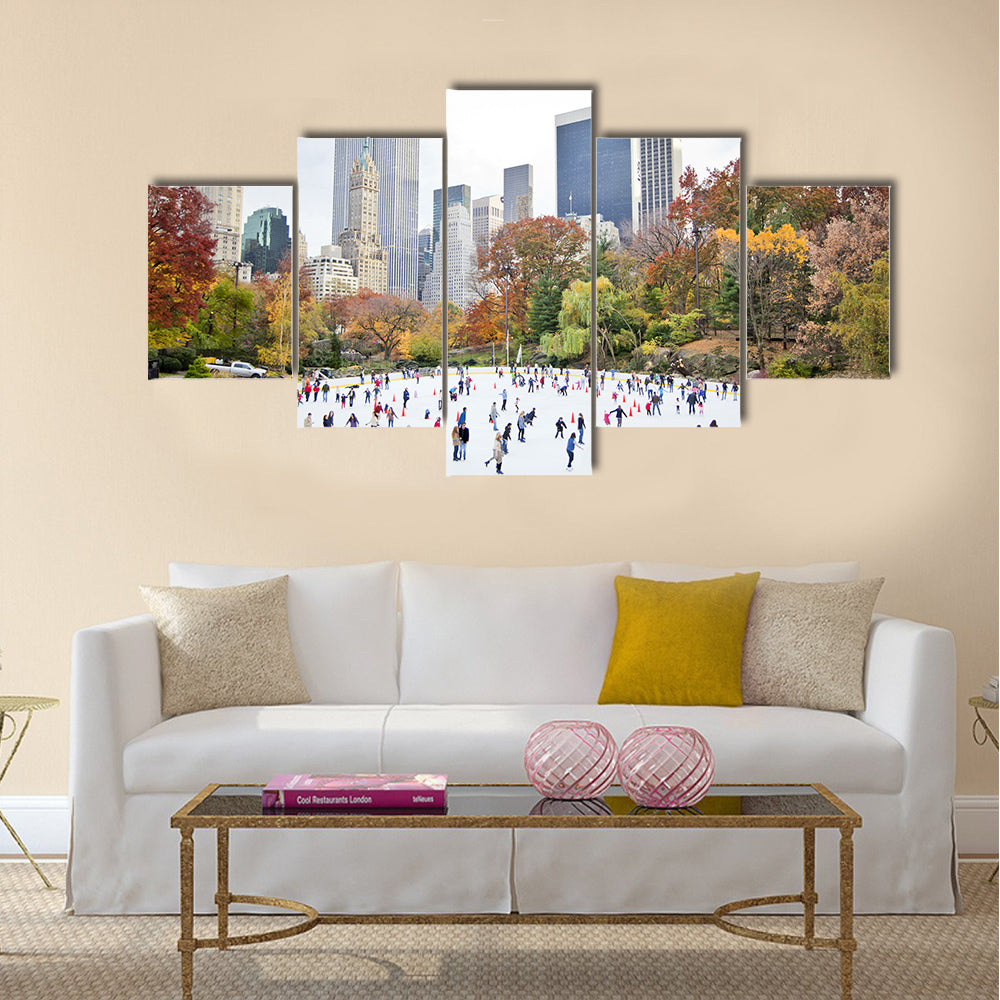 Ice skaters having fun in New York Central Park in fall Multi panel canvas wall art
