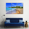 Jamaica. A national boat on sandy coast of a bay Multi panel canvas wall art