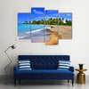 Jamaica. A national boat on sandy coast of a bay Multi panel canvas wall art