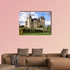 Saumur Chateau with dramatic sky behind and multi panel canvas wall art