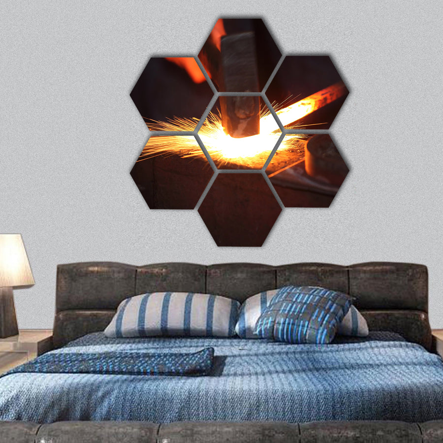 Hands of smith with hammer and steel stick hexagonal canvas wall art