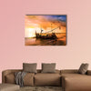 Local boat on the beach at sunset time, Bali, Indonesia multi panel canvas wall art