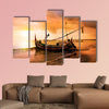 Local boat on the beach at sunset time, Bali, Indonesia multi panel canvas wall art