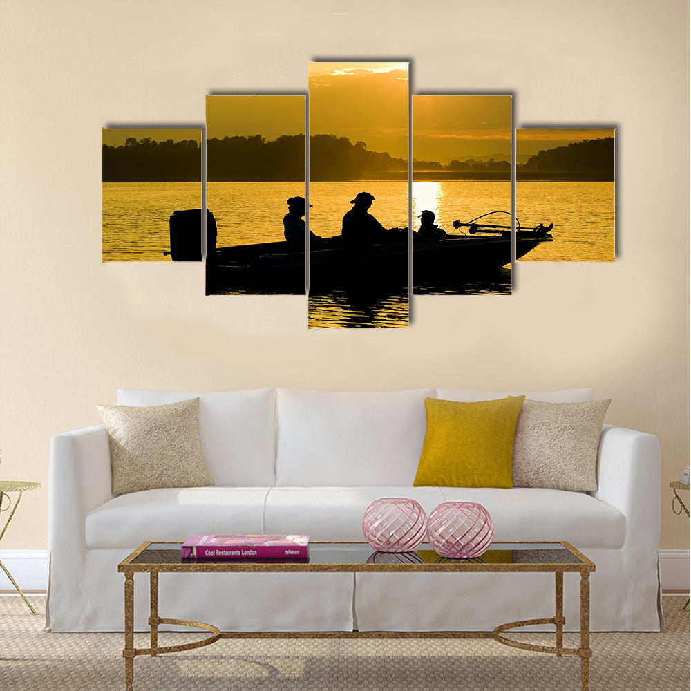 Fishermen boating on a lake at sunrise multi panel canvas wall art