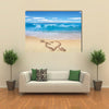 Heart with arrow, as love sign, drawn on the beach shore multi panel canvas wall art