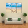 Heart with arrow, as love sign, drawn on the beach shore multi panel canvas wall art