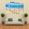 Heart with arrow, as love sign, drawn on the beach shore multi panel canvas wall art