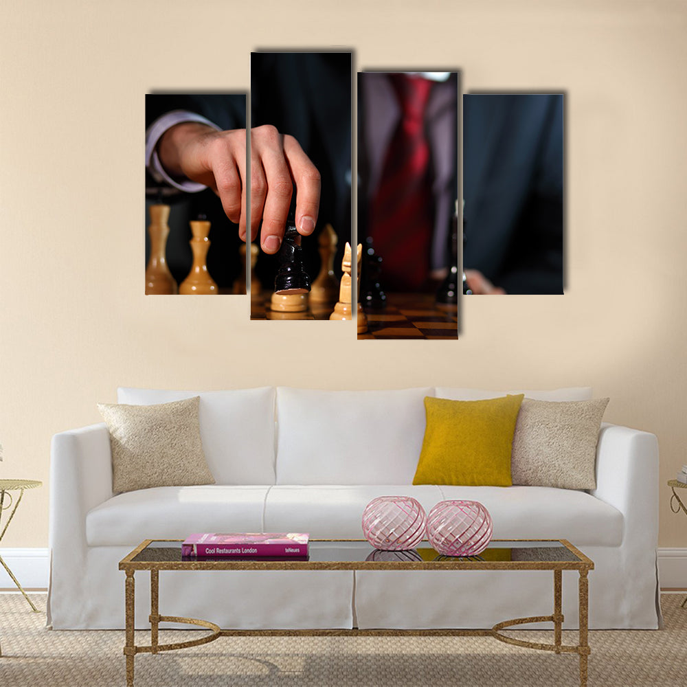 Canvas of a businessman in dark suit playing chess multi panel canvas wall art