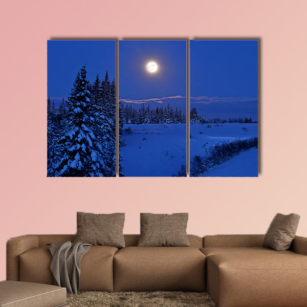 Full moon rising over a winter landscape in Alaska multi panel canvas wall art