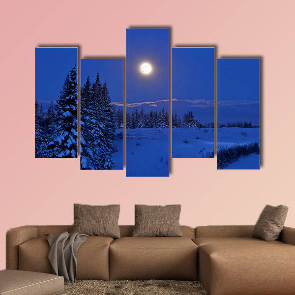 Full moon rising over a winter landscape in Alaska multi panel canvas wall art