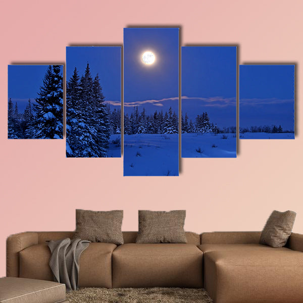 Full moon rising over a winter landscape in Alaska multi panel canvas wall art