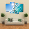 Beautiful view of Surfer on Blue Ocean Wave Multi panel canvas wall art