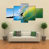 Surfer on Blue Ocean Wave Multi panel canvas wall art