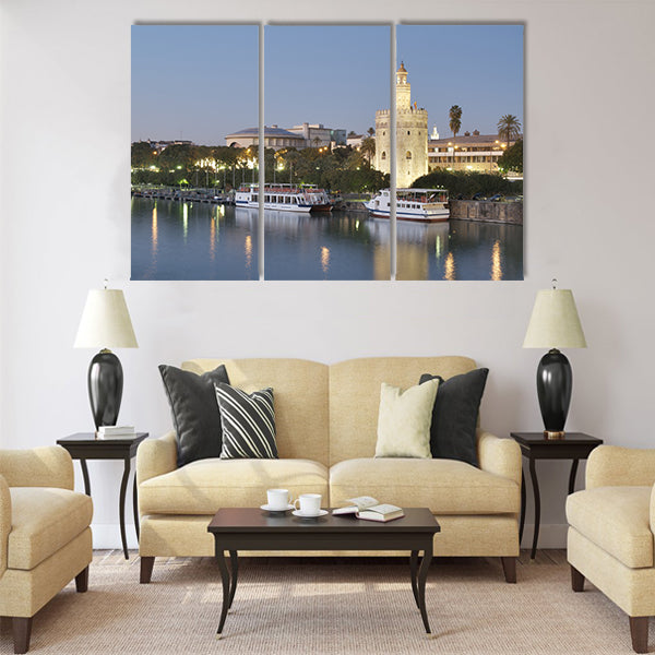tower of gold on the banks of the Guadalquivir River Multi panel canvas wall art