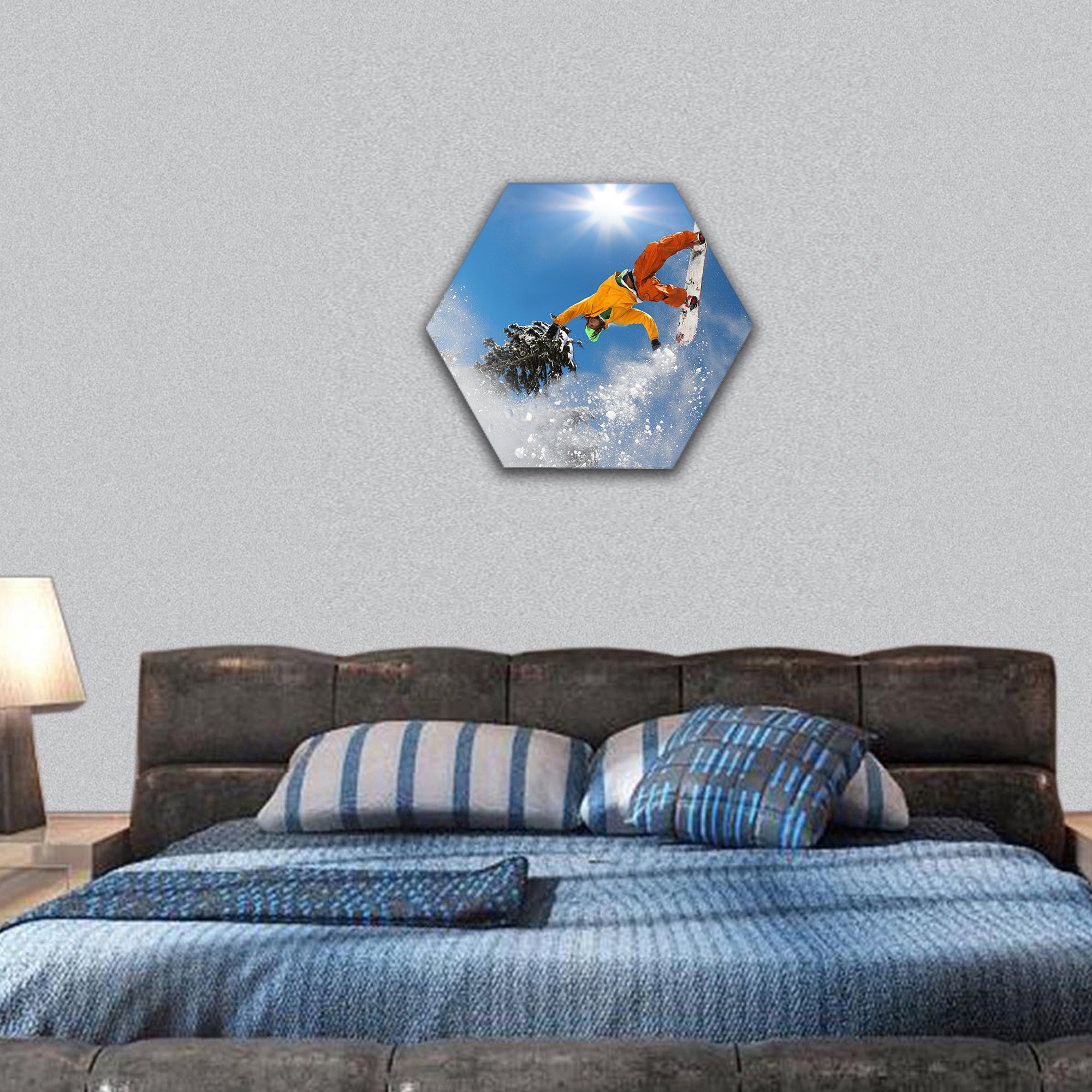 Snowboarder jumping against blue sky hexagonal canvas wall art