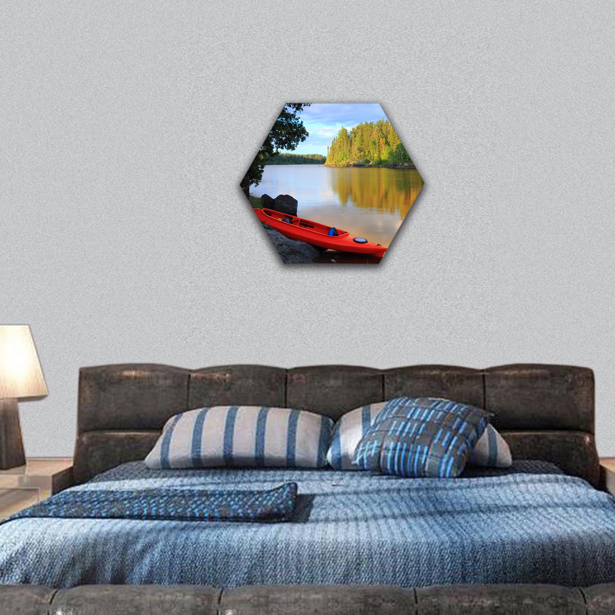 Red canoe sitting on rocks at lake in Minnesota hexagonal canvas wall art
