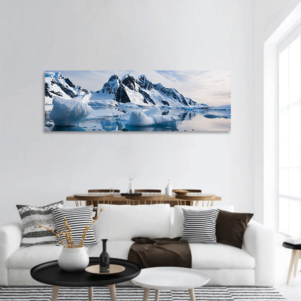 Snow-capped mountains against the blue sky in Antarctica panoramic canvas wall art