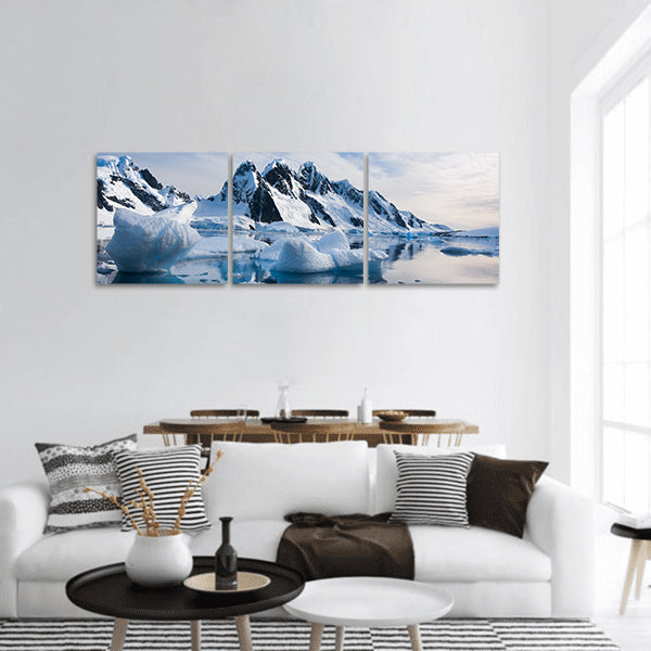 Snow-capped mountains against the blue sky in Antarctica panoramic canvas wall art