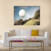 Golf ball flying over green field Multi Panel Canvas Wall Art