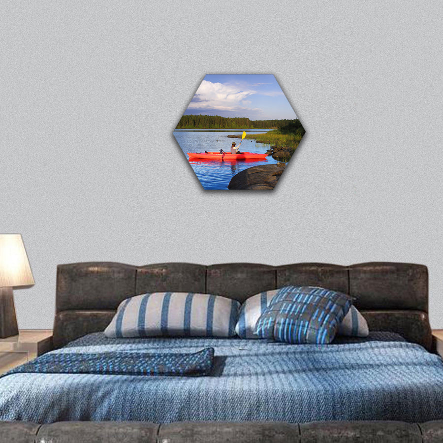 Woman canoeing in a beautiful lake at sunset hexagonal canvas wall art