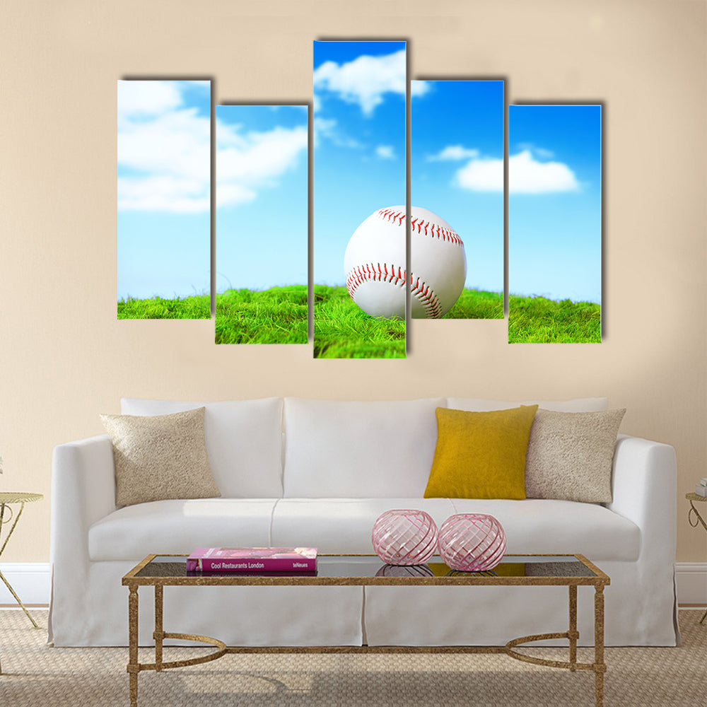 Base ball in green grass field with blue sky background Multi panel canvas wall art