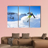 Skier skiing downhill on fresh powder snow with sun and mountains wall art