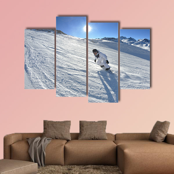 Skier skiing downhill on fresh powder snow with sun and mountains wall art