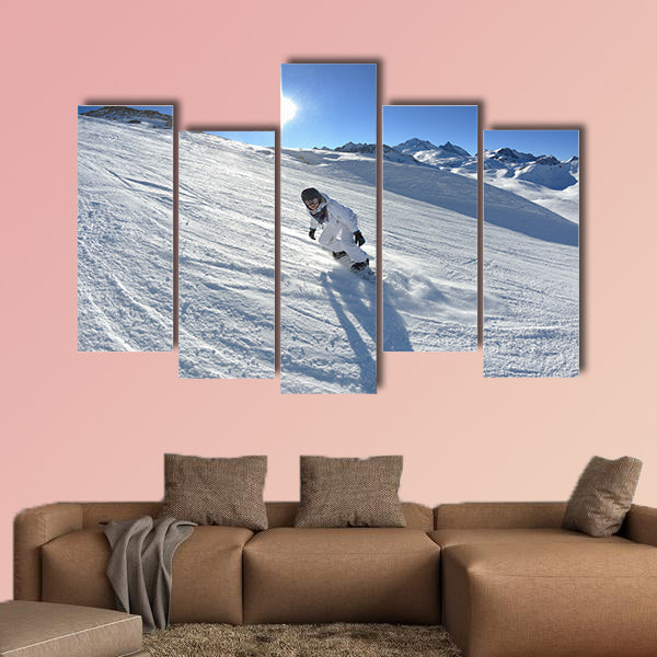Skier skiing downhill on fresh powder snow with sun and mountains wall art