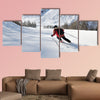 Skier skiing downhill on fresh powder snow with sun and mountains canvas wall art