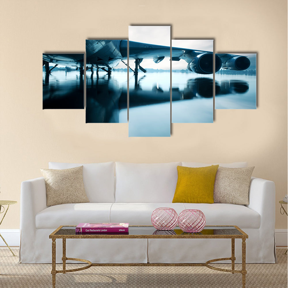 Airplane over water in the Thailand flooding at Donmaung International Airport multi panel canvas wall art
