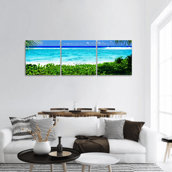 Deserted tropical beach lagoon framed by palm trees panoramic canvas wall art