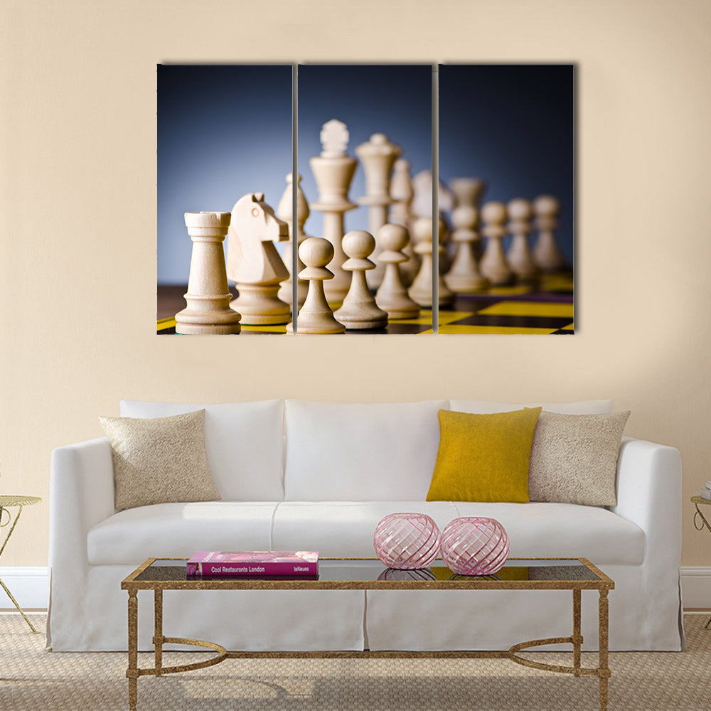 Concept of chess game with pieces multi panel canvas wall art