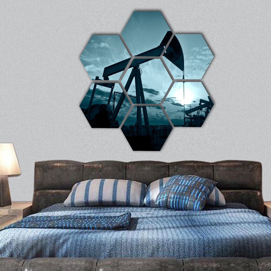 Silhouette oil pumps on a sunset sky hexagonal canvas wall art