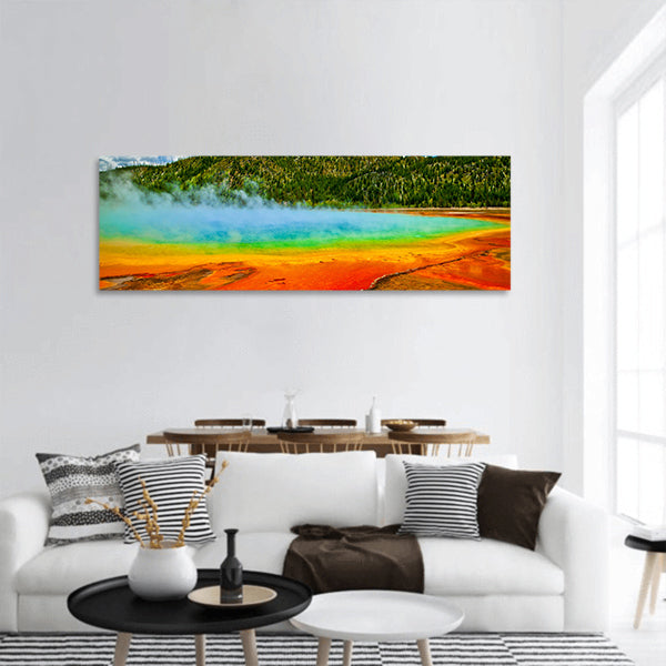 Beautiful cerulean geyser by colorful layers of bacteria, against cloudy blue sky panoramic canvas wall art