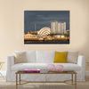 Sunlight on buildings as storm clouds gather beside River Clyde in Glasgow, UK, Multi Panel Canvas Wall Art