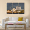 Sunlight on buildings as storm clouds gather beside River Clyde in Glasgow, UK, Multi Panel Canvas Wall Art