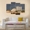 Sunlight on buildings as storm clouds gather beside River Clyde in Glasgow, UK, Multi Panel Canvas Wall Art