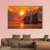 A boat sailing in front of a beautiful sunset in Key West, Florida multi panel canvas wall art