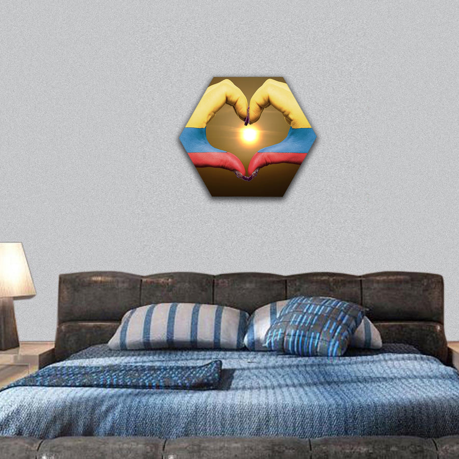 Gesture made by colombia flag hands showing symbol of heart during sunrise hexagonal canvas wall art