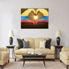 Gesture made by colombia flag colored hands Multi Panel Canvas Wall Art