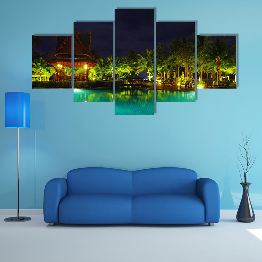 A Swimming pool in night illumination Multi Panel canvas wall art