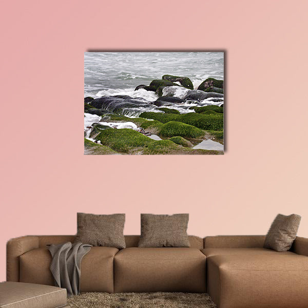 Stunning view of surf on green rock multi panel canvas wall art