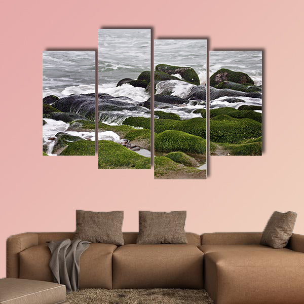 Stunning view of surf on green rock multi panel canvas wall art
